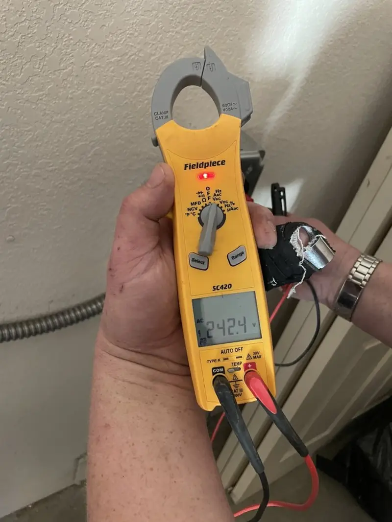 Voltage testing with clamp meter during Circuit Breaker Repair in Shady Shores
